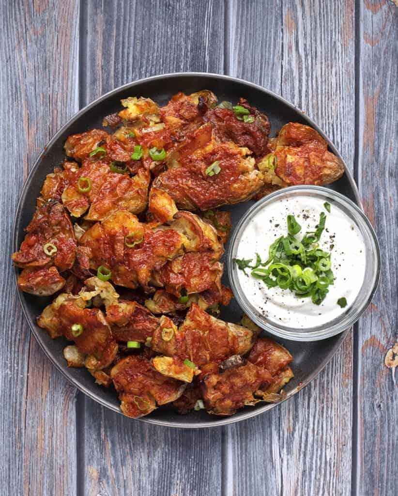 Buffalo Smashed Potatoes: The Ultimate Vegan Appetizer Served with a Side of Cashew Ranch Dip