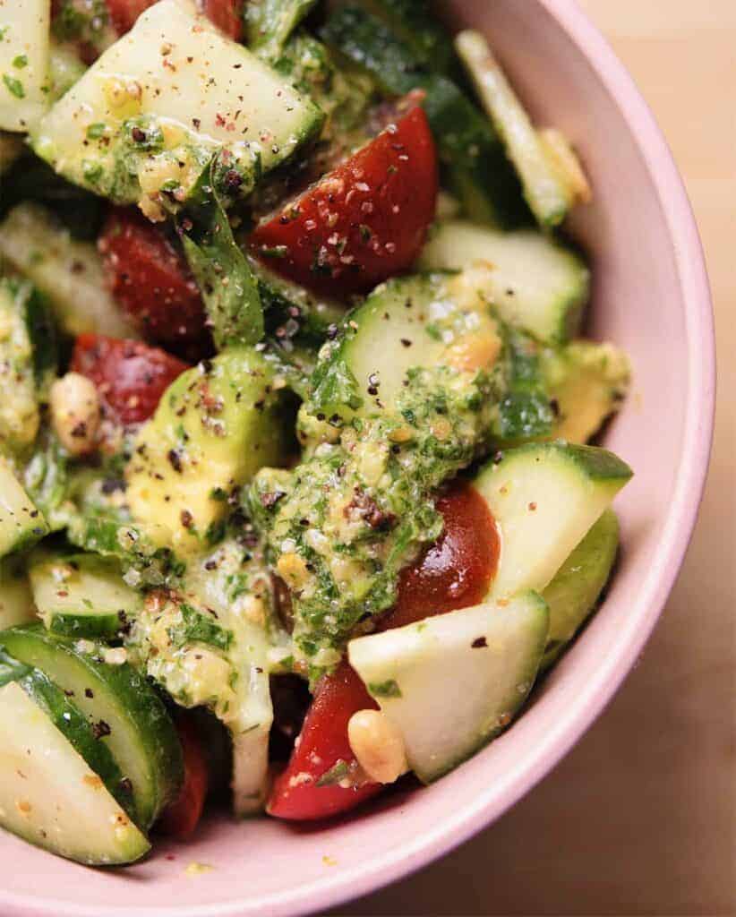 Vegan Caprese Salad This Tomato Cucumber Salad with Avocado and Vegan Pesto is a Twist on the Traditional