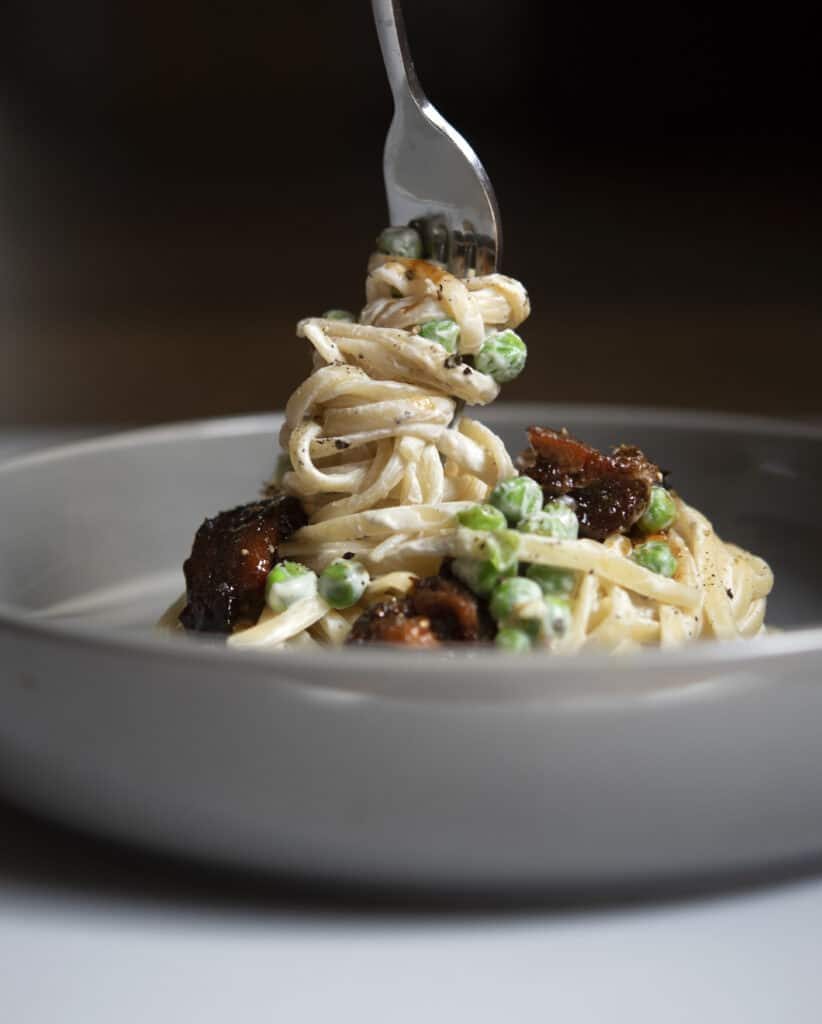 Creamy Cashew Alfredo with Vegan Pancetta and Peas